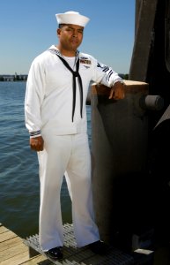 070919-N-5319A-001 A sailor shows off a prototype service dress white uniform that focuses on better fabric and fit of the uniform photo
