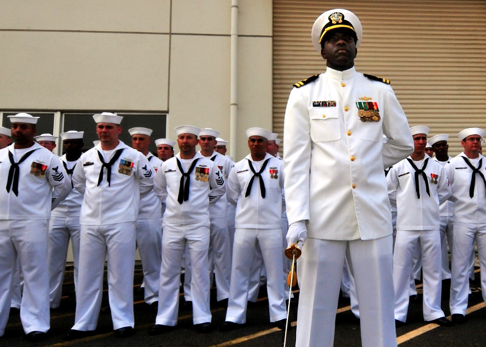 080807-N-0807W-190 The mineman crew of the Avenger-class minesweeper USS Patriot (MCM 7) standby in their dress white uniforms during a pier side change of command ceremony at Fleet Activities Sasebo