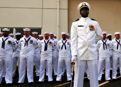 080807-N-0807W-190 The mineman crew of the Avenger-class minesweeper USS Patriot (MCM 7) standby in their dress white uniforms during a pier side change of command ceremony at Fleet Activities Sasebo
