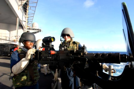 081111-N-3610L-241 - Aviation Ordnanceman 3rd Class Brittany Cooper prepares to shoot a .50 caliber machine gun