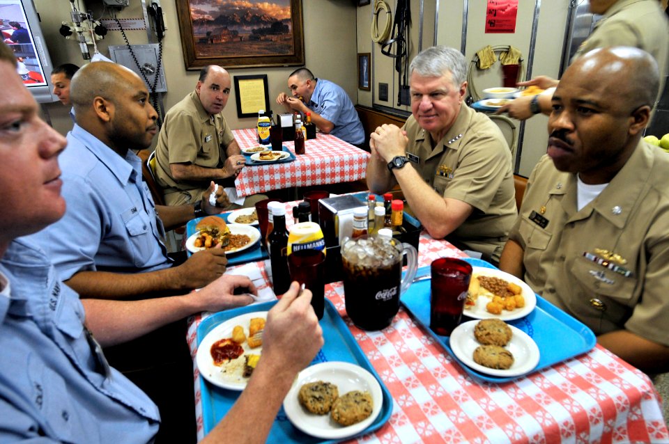 090219-N-8273J-162 - Chief of Naval Operations ADM Gary Roughead has lunch with PO2 Matthew Edlin, PO1 Sterling Sims, and CDR Roger Isom