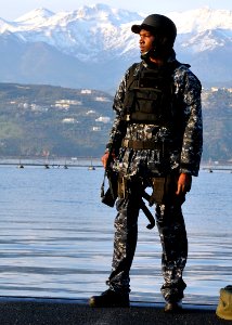 090317-N-0780F-003 A sailor wearing the Navy's new working uniform stands a top-side security watch as the Los Angeles class attack submarine USS Scranton (SSN-756) gets underway after a routine port visit to Souda Bay