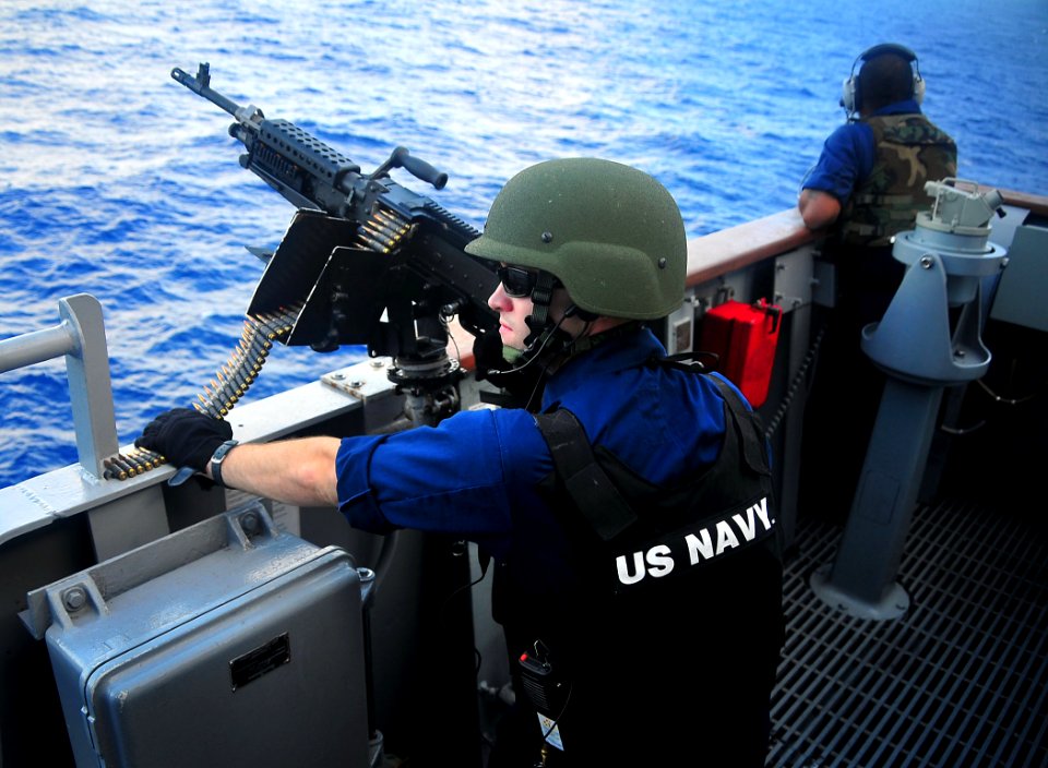 090129-N-4774B-015 - A sailor mans a .50-caliber machine gun before a live-fire exercise