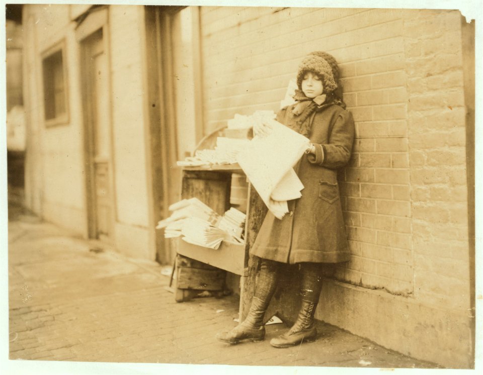 10 yr old girl tending stand at 4th and Garden Streets. On the right is entrance to bar room of saloon. Stand is owned by Mr. Rakoff, whose daughters, 11 yrs. and 13 yrs. old, take turns LOC nclc.03827