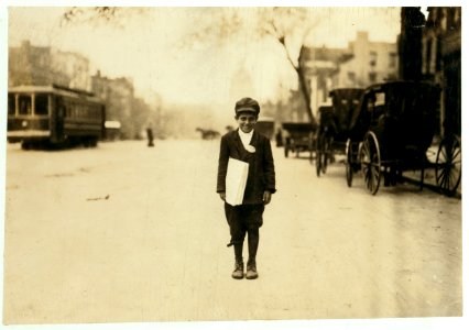 10 yr. old news-boy selling during school hours, but he said that he only goes to school in the afternoons. The half-day system makes it very hard to check up truants, but a good many of the LOC nclc.03772 photo