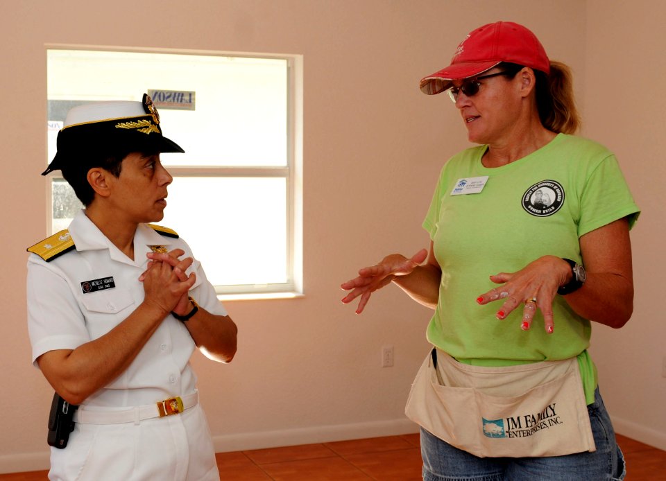 100428-N-1522S-004 RDML Michelle Howard speaks with Mary Lou Bowman Cubbin where 10 sailors are volunteering as part of Fleet Week Port Everglades