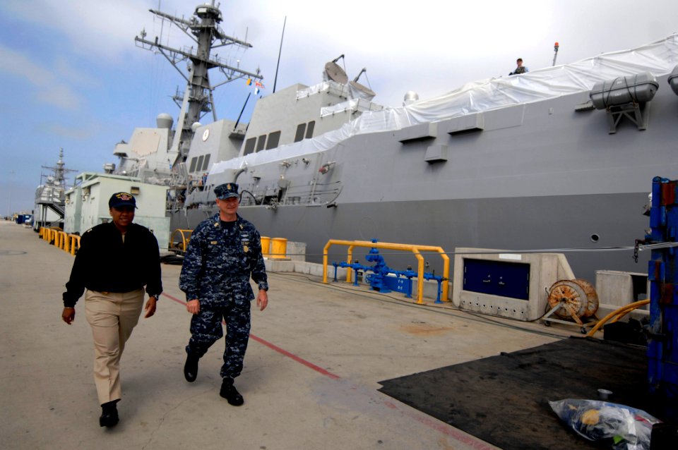 100505-N-9818V-203 MCPON Rick West walks down the pier with CMDCM Sharon M. Fortson after visiting sailors aboard USS Sampson (DDG-102)