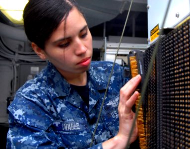 110702-N-MJ491-131 - Airman Analia Ovalle troubleshoots a general-purpose interface console aboard the aircraft carrier USS Ronald Reagan CVN 76 in the Arabian Sea on