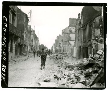 111-SC-191719 - Advance guard of 29th Infantry Division entering St. Lo, France. July 20, 1944
