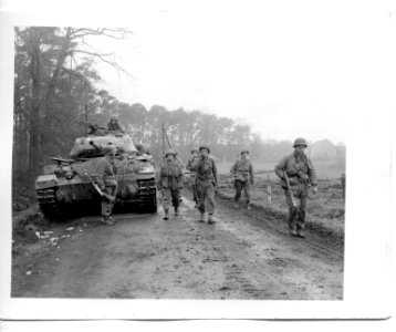 111-SC-270975 - Armor and infantry of the 30th Division, 9th U.S. Army, move through Wesel forest, Germany, in pursuit of the fleeing 116th Panzer Division