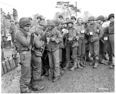 111-SC-349558 - Soldiers of a tank destroyer battalion warm themselves with coffee before going into action against the Germans near Stolberg, Germany