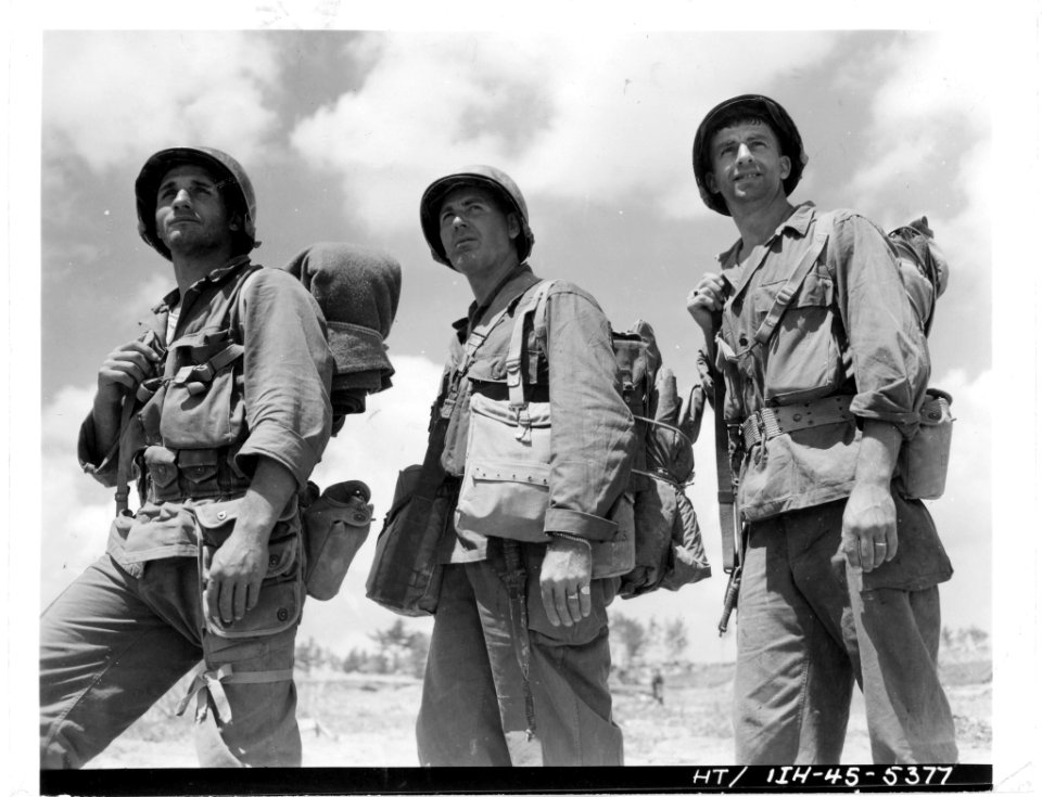 111-SC-374740 - Three Rochester men, each a veteran of all campaigns in which the 77th Div has participated, move up to the front