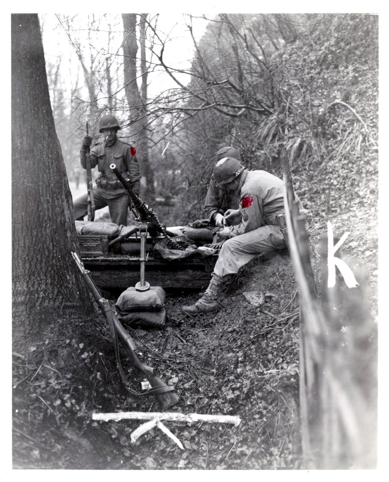 111-SC-360934 - A .50 caliber machine gun and crew are set to repel attack by advancing Germans near Malmedy, 22nd December, 1944. 120th Regiment, 30th Division