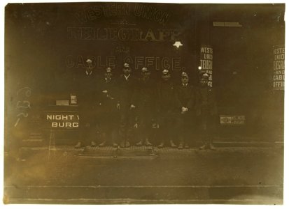 A group of messenger boys. These work until 11 P.M. LOC nclc.03274