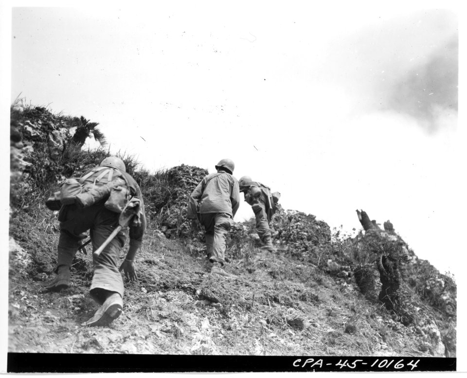 111-SC-337970 - Tenth Army doughboys of the 96th Division approach the top of Big Apple Hill, heavily fortified position, captured during an intense battle with Japanese troops on 15 June