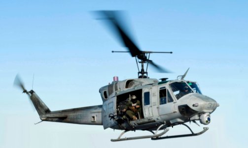 120131-N-XK513-120 Sailor directs a UH-1N Huey helicopter from (VMM) 261 (cropped)