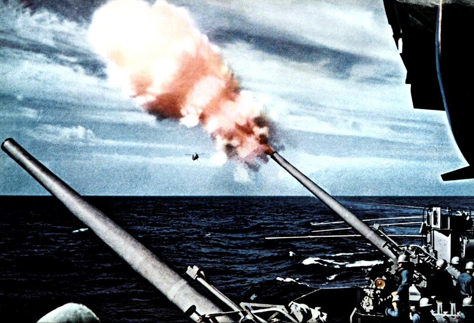 127 mm anti-aircraft guns firing aboard USS Oriskany (CVA-34), in 1956