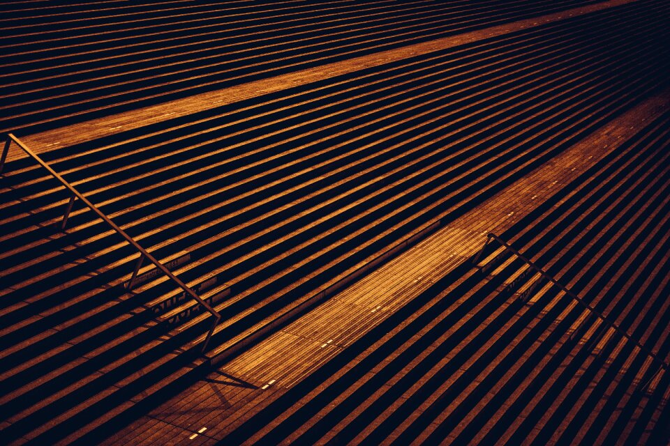 Empty bleachers line photo