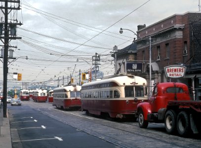 TTC 4427 (PCC) Line up of PCCs on Queen St. looking owards Roncesvalles during morning rush hour, Toronto, ONT on July 4, 1966 (22592979761)