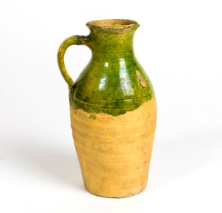 A green glaze pottery jug