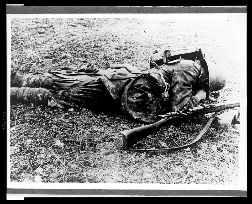 A German soldier, probably a sniper, laying on the ground LCCN2005697189