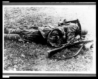 A German soldier, probably a sniper, laying on the ground LCCN2005697189 photo