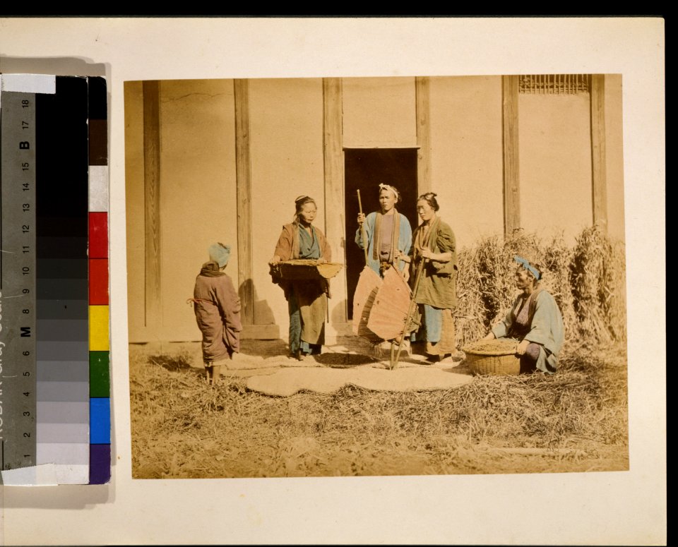 A group of people, possibly street vendors or farmers, two men and two women, two are holding baskets, and one person with back to camera may be a woman LCCN2009632881