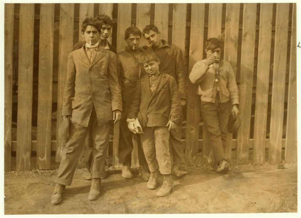 A group working on night shift at Hereford Glass Works, Cape May Court House, N.J. November 19, 1909. I saw the smalles(t) boy carrying in shortly before midnight, November 18th. LOC cph.3a47676