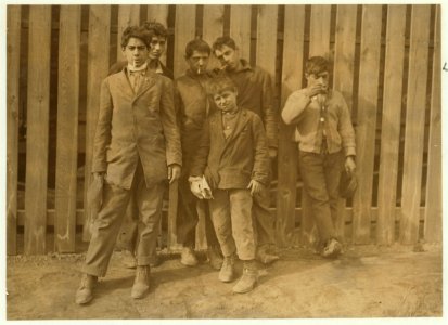A group working on night shift at Hereford Glass Works, Cape May Court House, N.J. November 19, 1909. I saw the smalles(t) boy carrying in shortly before midnight, November 18th. LOC cph.3a47676
