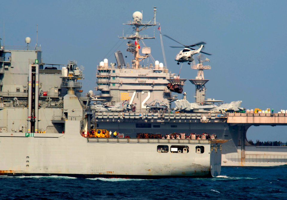 A helicopter flies supplies to USS Abraham Lincoln. (6641124545)