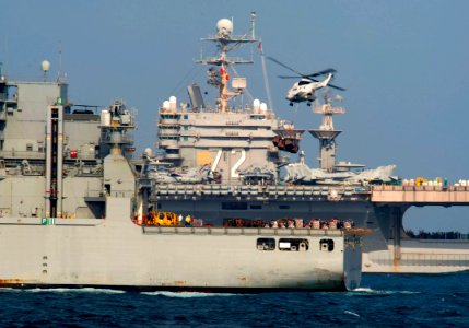 A helicopter flies supplies to USS Abraham Lincoln. (6641124545)
