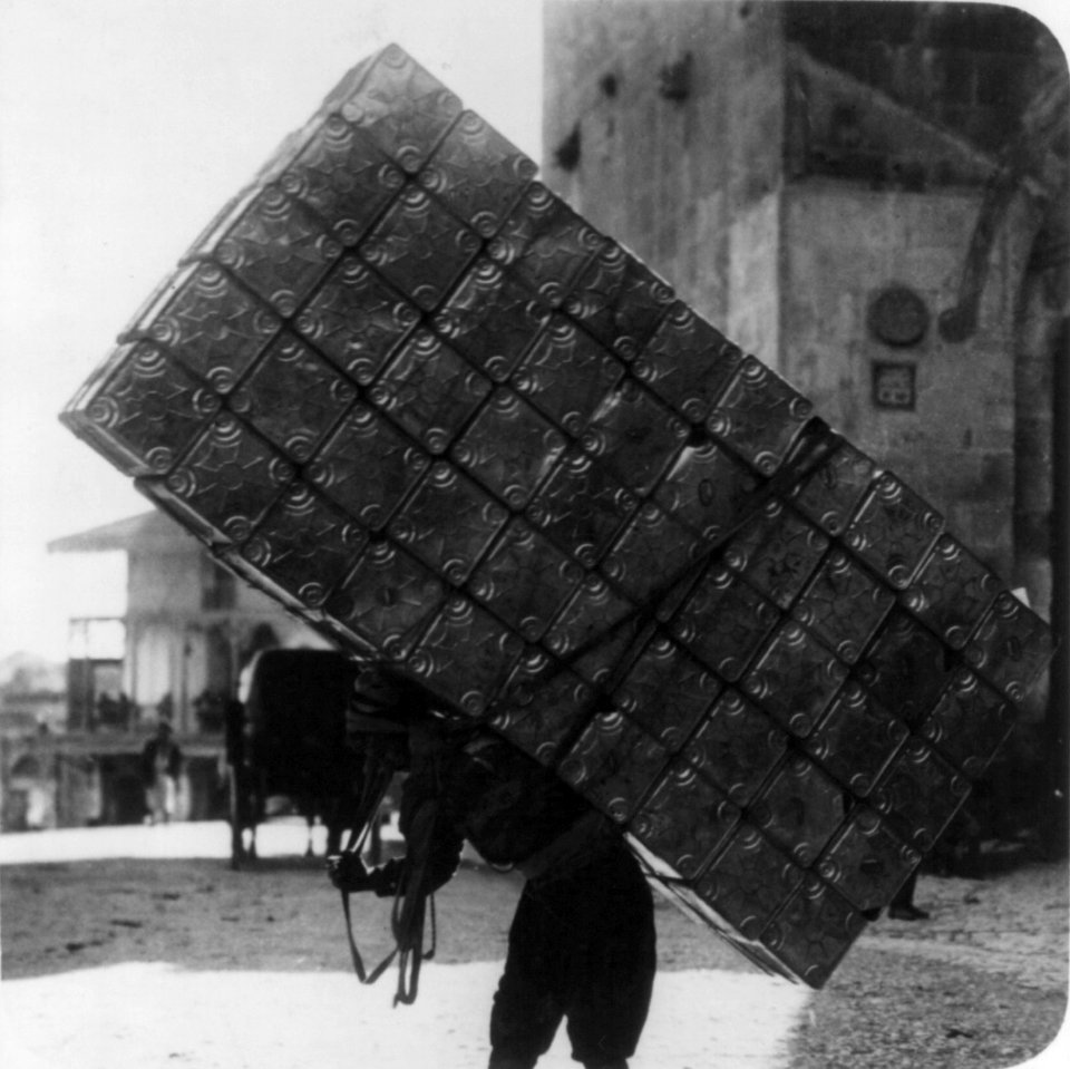A Jerusalem porter carrying fifty empty petrol tins on his back LCCN2002699563 (cropped)