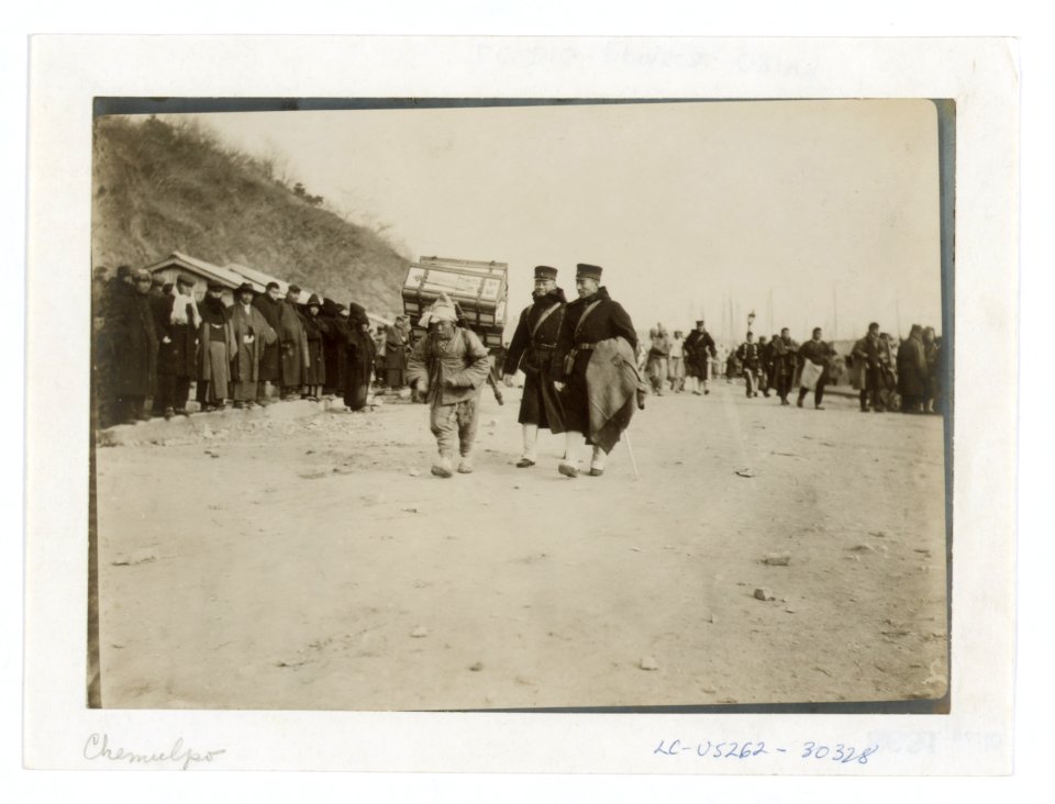A Korean coolie carrying medical supplies from shore to hospital at Chemulpo LCCN2005679322