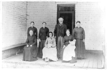 A Latter Day Saint with five wives and his mother (posed on porch) LCCN2003663781