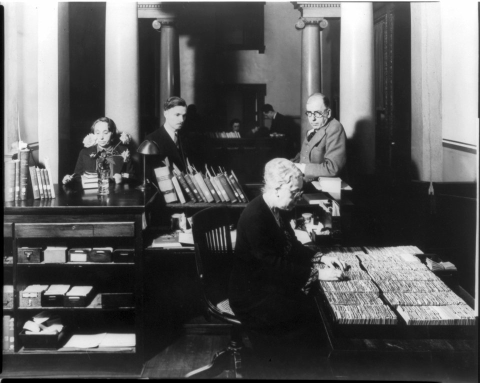 A Library of Congress staff member checking her card file LCCN2011647042