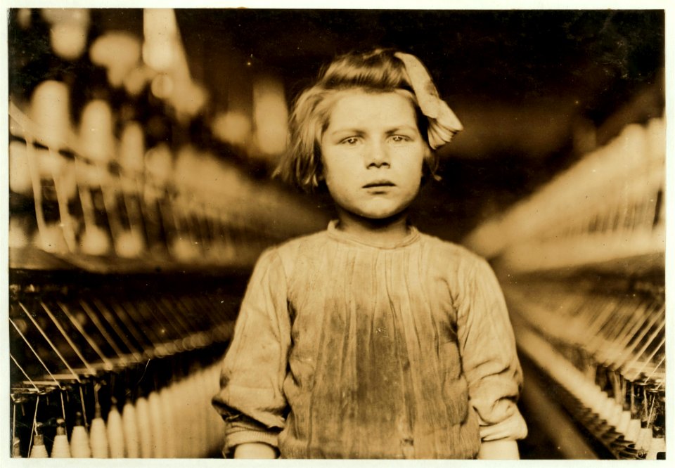 A little spinner in Globe Cotton Mill. Augusta, Ga. The overseer admitted she was regularly employed. LOC nclc.05395