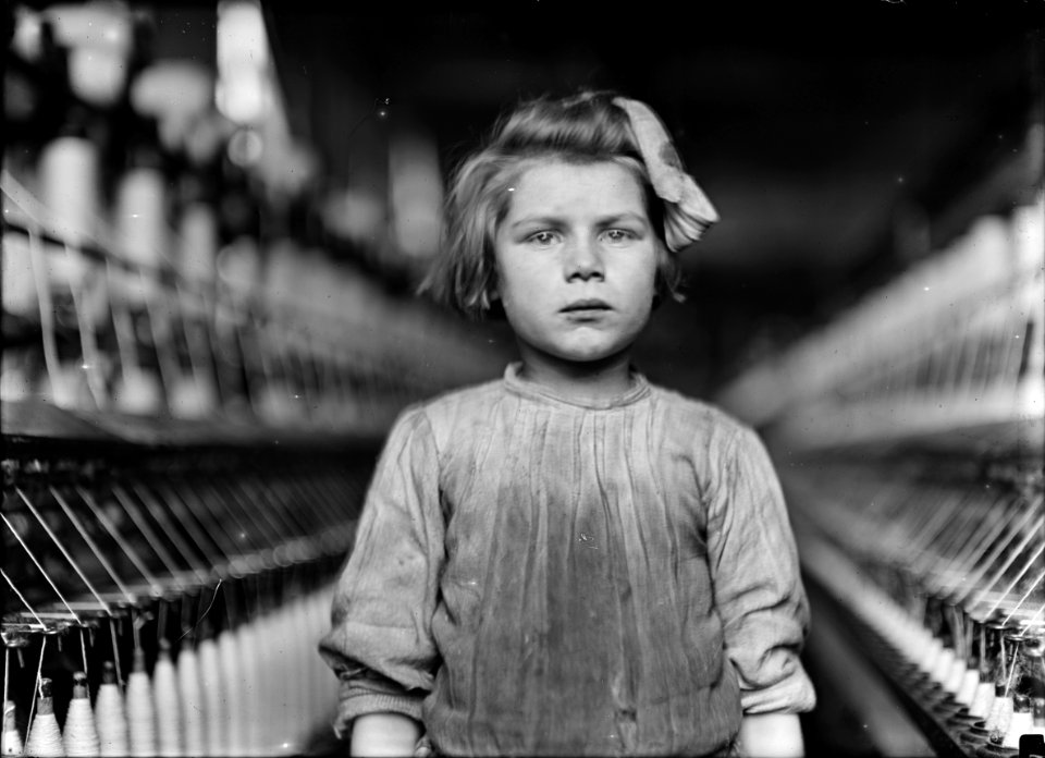 A little spinner in the Globe Cotton Mill. The overseer admitted she was regularly employed there. Augusta, Ga. - NARA - 523149
