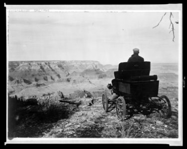 A member of the pioneer automobile party in a Toledo car at the rim of the Grand Canyon, Grand View Park, Arizona, Feb. 5, 1902 LCCN2015645804