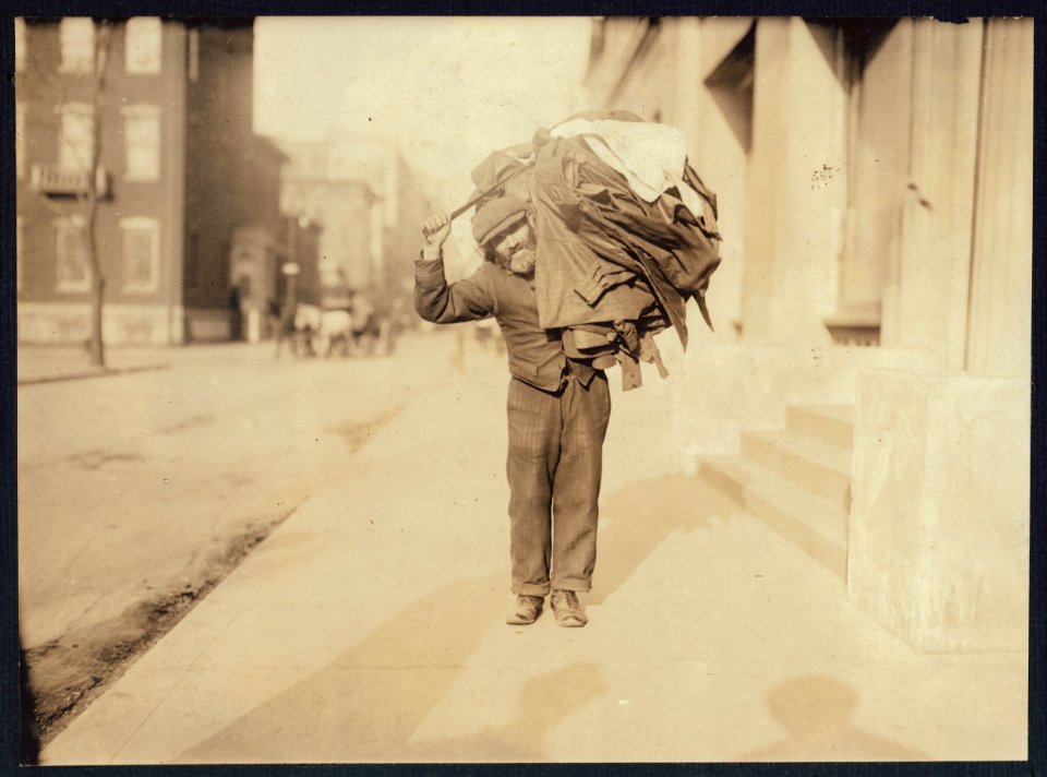 A modern Atlas. The Home-work Burden. Said he made button-holes at home. Washington Square, N.Y. LOC nclc.04184