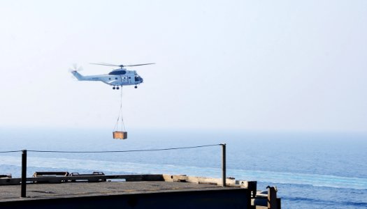 A Military Sealift Command SA-330J Puma helicopter transports cargo to the aircraft carrier USS George H.W. Bush (CVN 77) during a replenishment at sea in the Persian Gulf Aug. 27, 2014 140827-N-CZ979-010