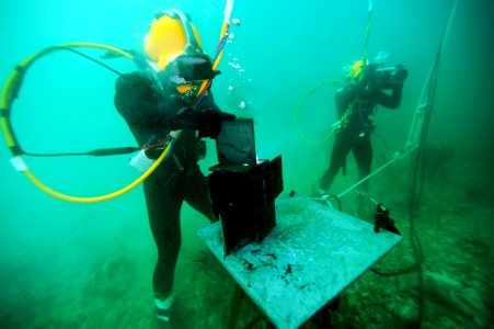 A Navy diver uses an underwater welding torch. (8407482809)