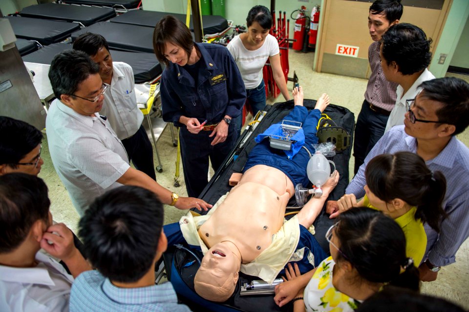 A neonatologist from Vietnam asks Lt a question about inserting chest tubes during a subject matter expert exchange aboard USNS Mercy. (27818302333)
