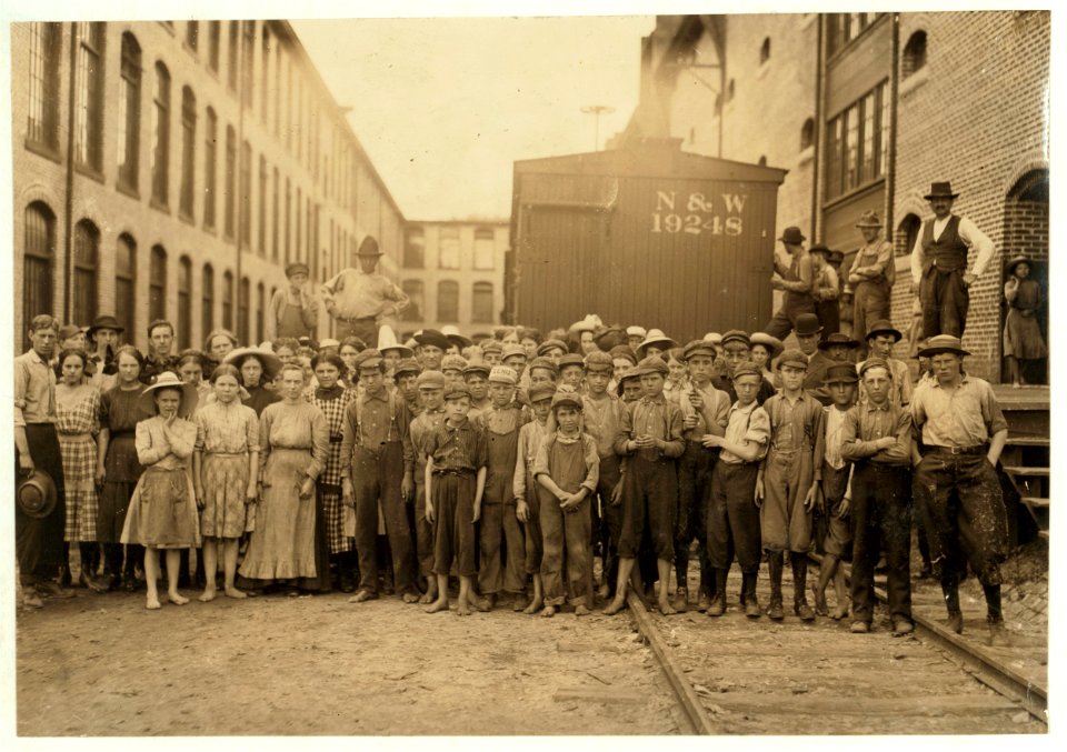 A part of the spinning force working in the Washington Cotton Mills, Fries, Va. Group posed by the overseer. All work. The overseer said, 'These boys are a bad lot.' All were alive to the LOC nclc.02073