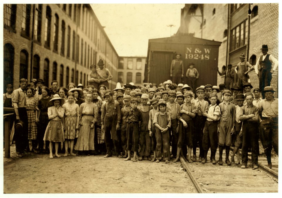 A part of the spinning force working in the Washington Cotton Mills, Fries, Va. Group posed by the overseer. All work. The overseer said, 'These boys are a bad lot.' All were alive to the LOC nclc.02074