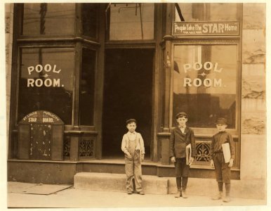 A Pool Room Branch (Chouteau & Manchester). These boys were playing pool and smoking in the Pool Room while waiting for papers. The smallest boy is 9 years old and sells until 9 P.M. (See LOC nclc.03461