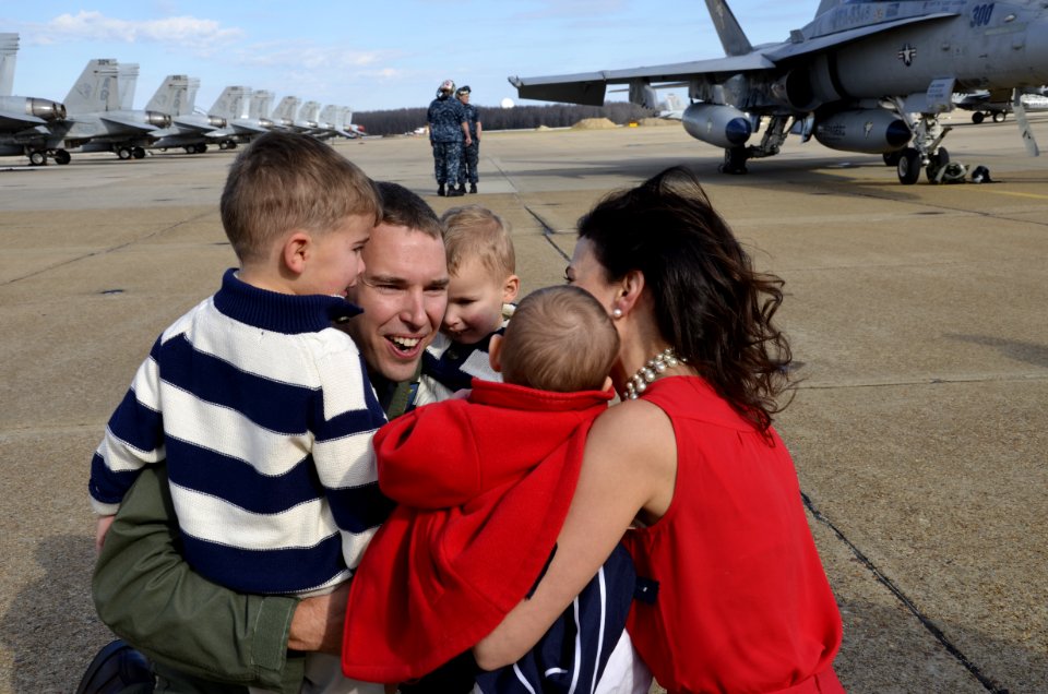 A pilot reunites with his family. (8291331854)