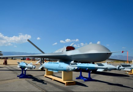 A Predator C Avenger unmanned aircraft system and inert ordnance sit on display on a tarmac at Palmdale, Calif., Aug. 8, 2012 120808-N-WL435-054