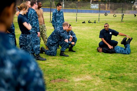 A police instructor teaches takedown techniques. (8233129100)