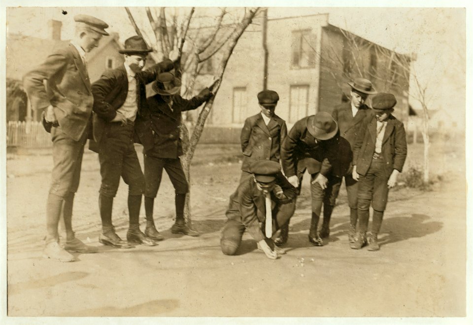 A quiet game of marbles. All the boys work in the Salisbury (N.C.) cotton mill. The boy shooting is Henry Dedman, a warper. Been in mill 5 years. His grandmother said 'I don't like to have ' LOC nclc.01558