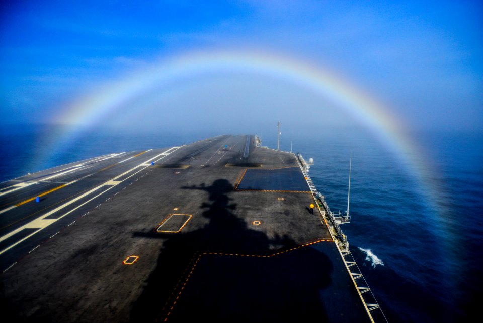 A rainbow forms over the bow of USS John C. Stennis. (16416701076)